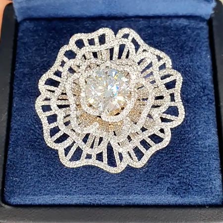 Flower ring with a 3.55 ct center diamond and a scattering of 3.483 ct diamonds